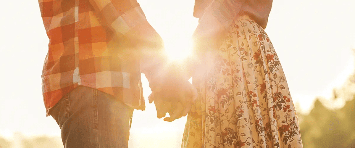Happy couple holding hands